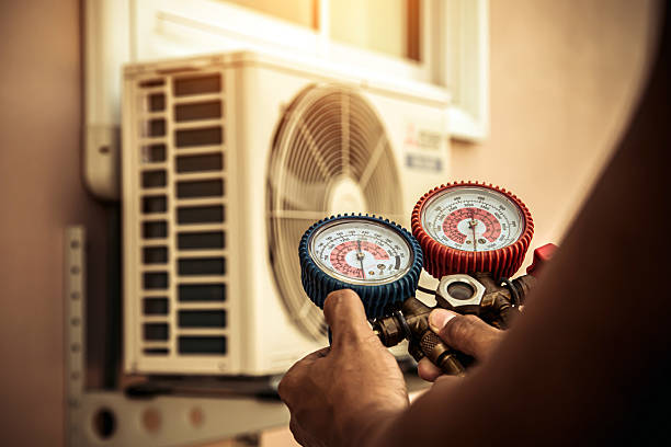 Professional Air Conditioning Service technician working in Milo, IA